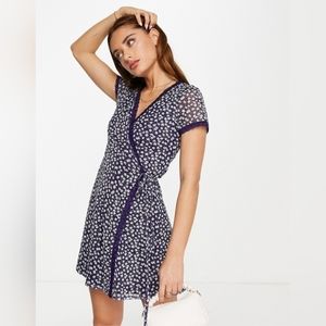 ASOS DESIGN mini mesh wrap dress with lace trim in navy daisy print